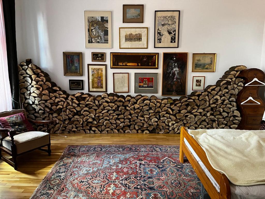 a living room with a couch made out of logs at ApartmentVillaSolomon7 in Visegrád