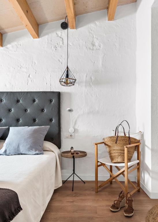 Postel nebo postele na pokoji v ubytování Hotel Boutique Ses 5 Claus
