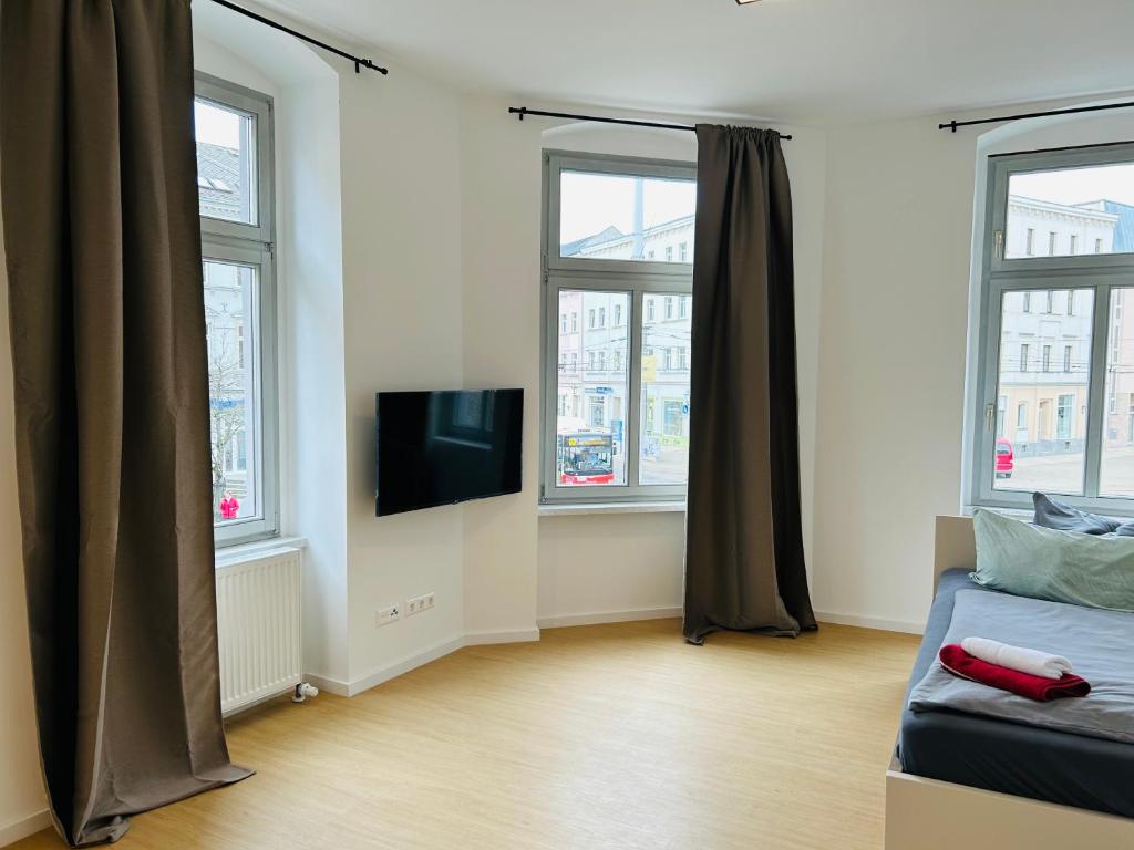 TV a/nebo společenská místnost v ubytování City Apartment in Zwickau WIFI NETFLIX ZENTRUM