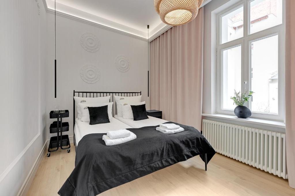 Posteľ alebo postele v izbe v ubytovaní Sopot Monte Cassino Boutique by Downtown Apartments