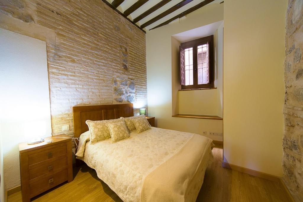 Postel nebo postele na pokoji v ubytování Apartamentos del Casco