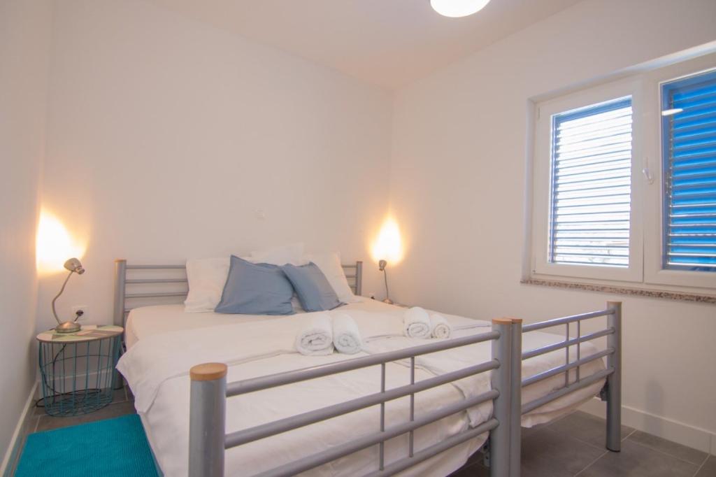 Posteľ alebo postele v izbe v ubytovaní Apartments Dunato Nedeljko