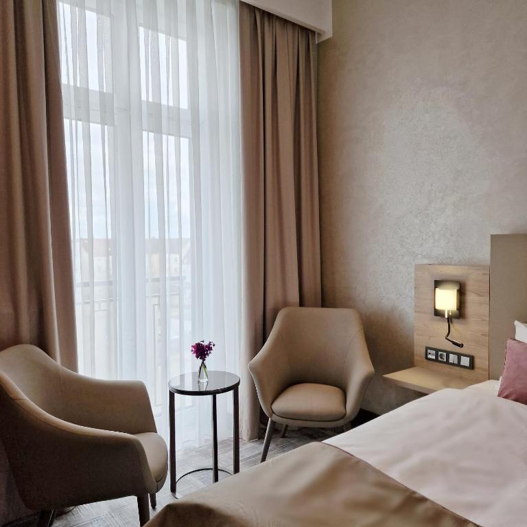 Postel nebo postele na pokoji v ubytování Hotel Kaiserhof