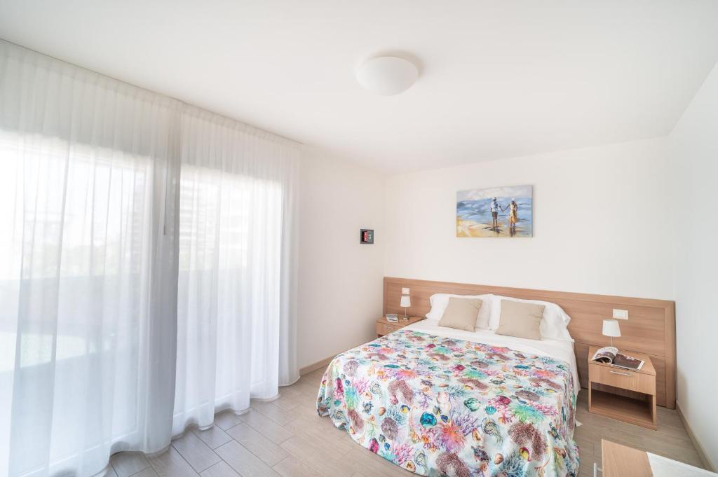 Postel nebo postele na pokoji v ubytování Residenza Monica
