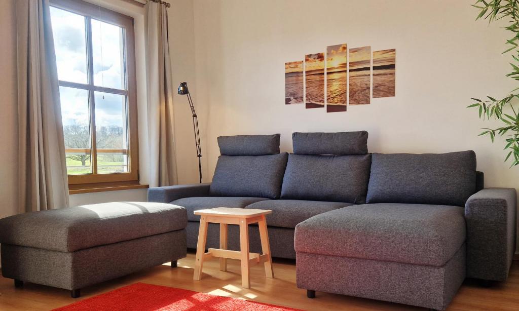 Χώρος καθιστικού στο Ferienwohnung Land & Strand
