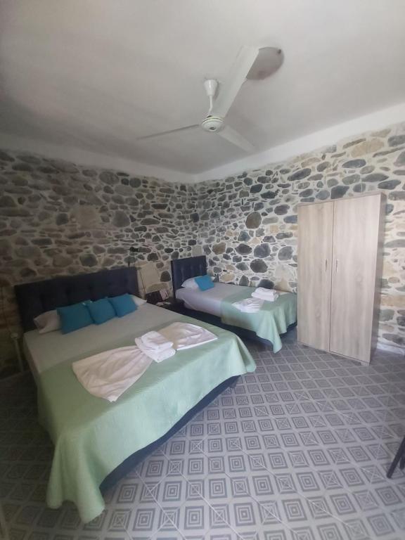 Postel nebo postele na pokoji v ubytování Mariaeva Rooms