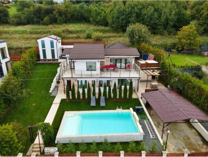 an aerial view of a house with a swimming pool at RAX Panoramic House in Feleacu