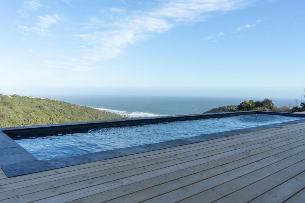 a swimming pool on the roof of a house at Views over Wilderness in Wilderness