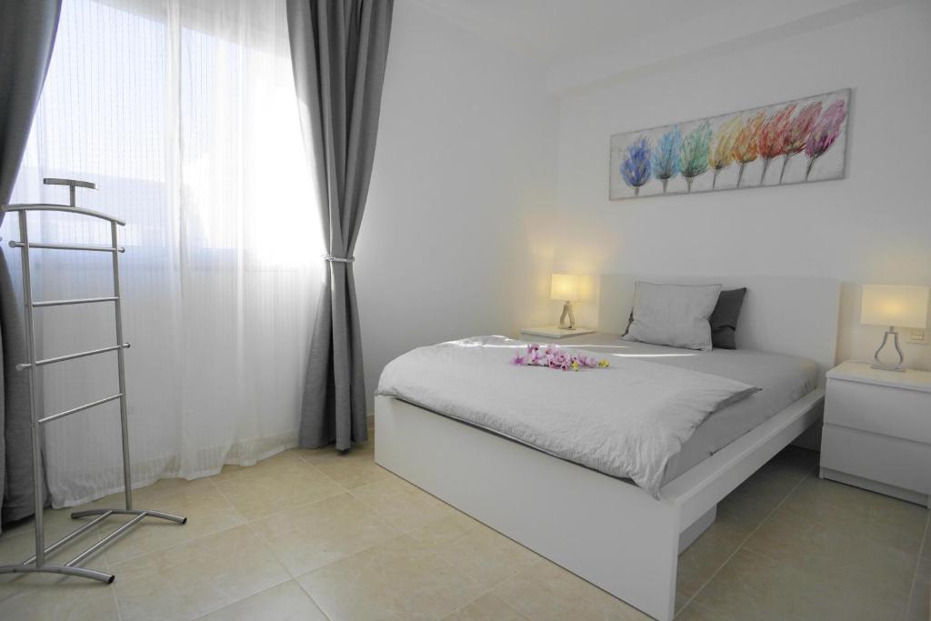 Postel nebo postele na pokoji v ubytování Villa Patricia Playa Blanca