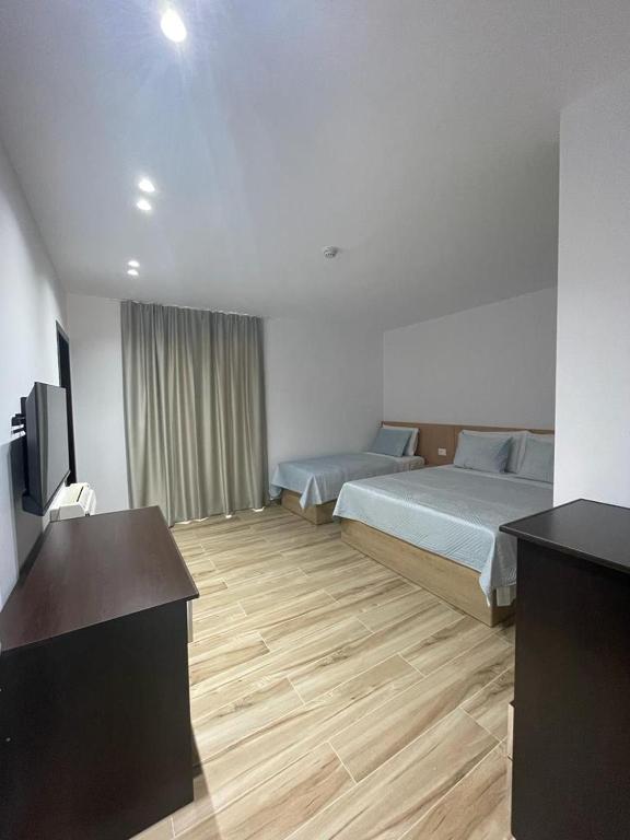Letto o letti in una camera di Hotel Verzaci