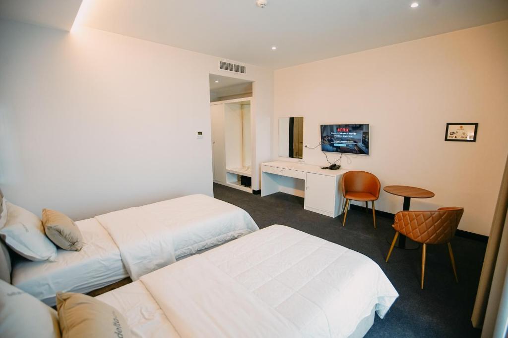 TV a/nebo společenská místnost v ubytování Hotel Delta Premium