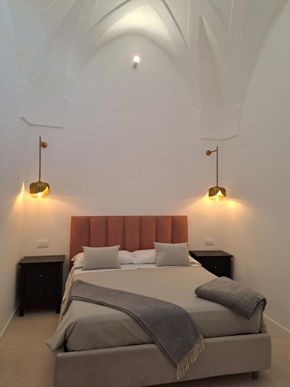Postel nebo postele na pokoji v ubytování Palazzo AD 1892 - SUITES & SPA