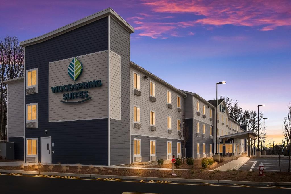 a rendering of the front of a building at WoodSpring Suites South Brunswick - Princeton in Monmouth Junction