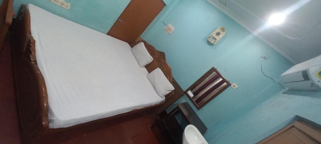 Postel nebo postele na pokoji v ubytování Kiran Guest House