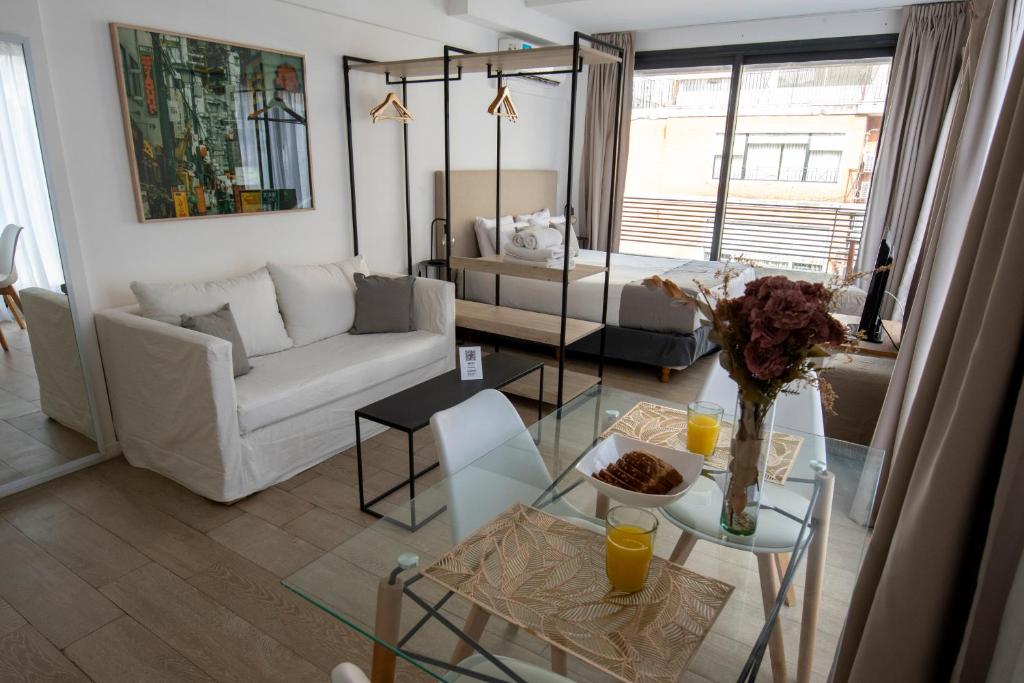 a living room with a couch and a table at Babel Alto in Buenos Aires