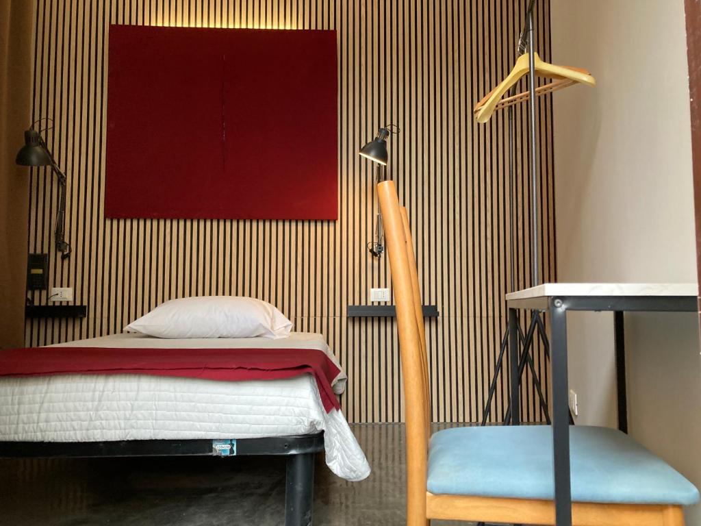 A bed or beds in a room at Hotel Calypso