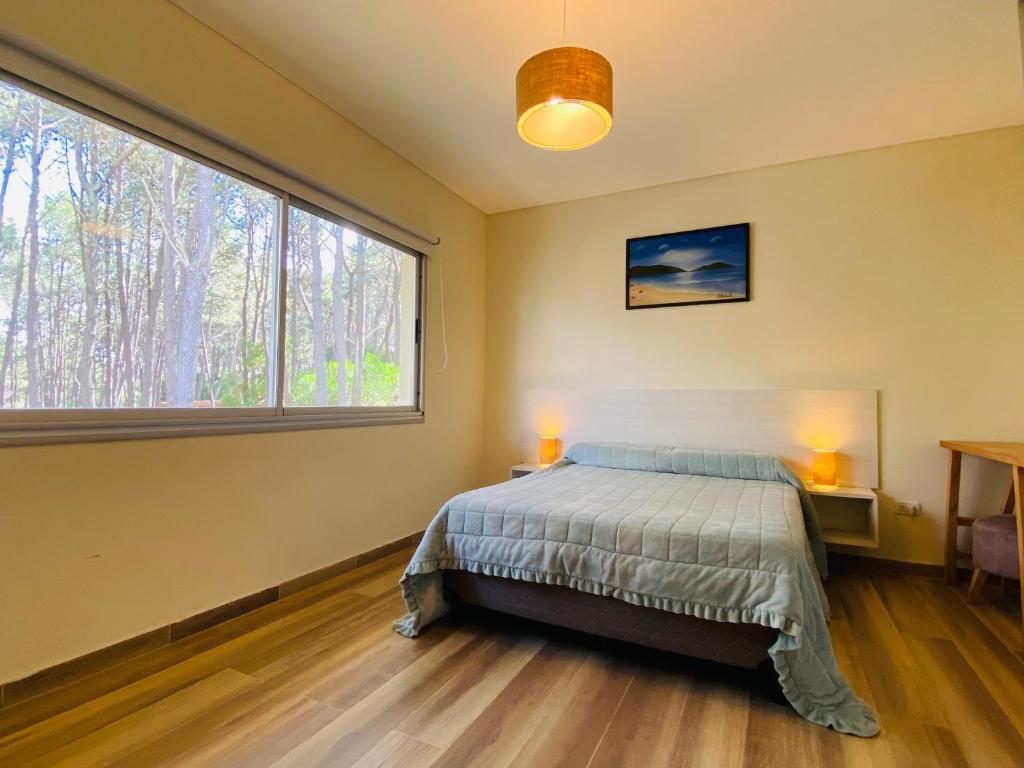 Katil atau katil-katil dalam bilik di Ubatuba Lofts Mar Azul - depto 1 hab