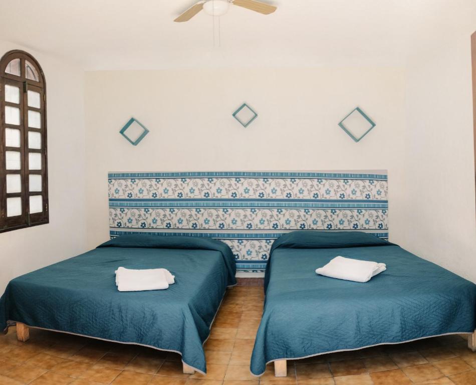 Postel nebo postele na pokoji v ubytování Casona Luciérnaga-Casa de Huéspedes