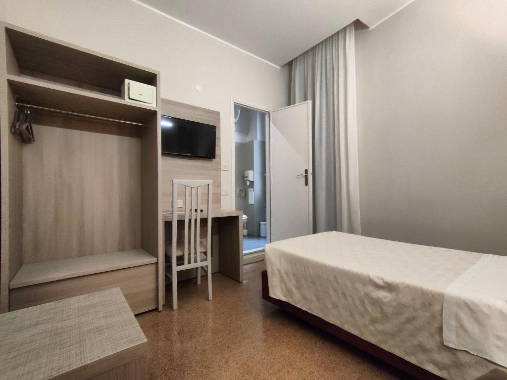 Posteľ alebo postele v izbe v ubytovaní Hotel Vittoria
