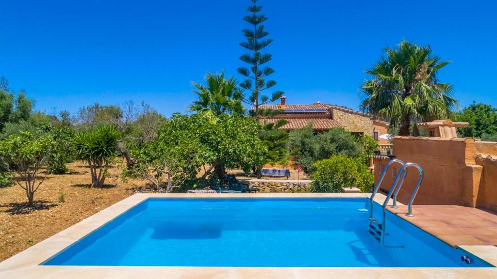 a swimming pool in front of a villa at Cala mezquida - 42214 Mallorca in Capdepera