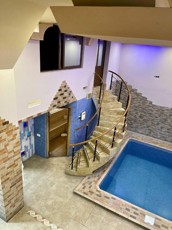 TV a/nebo společenská místnost v ubytování JOY Hotel