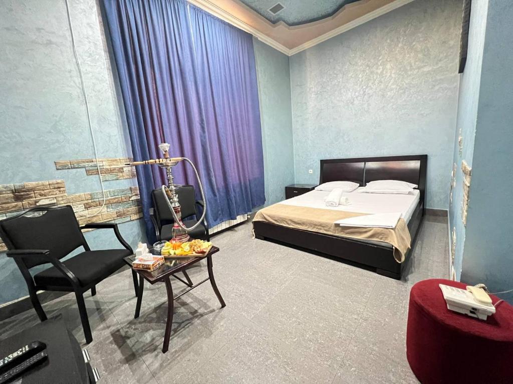 Postel nebo postele na pokoji v ubytování JOY Hotel