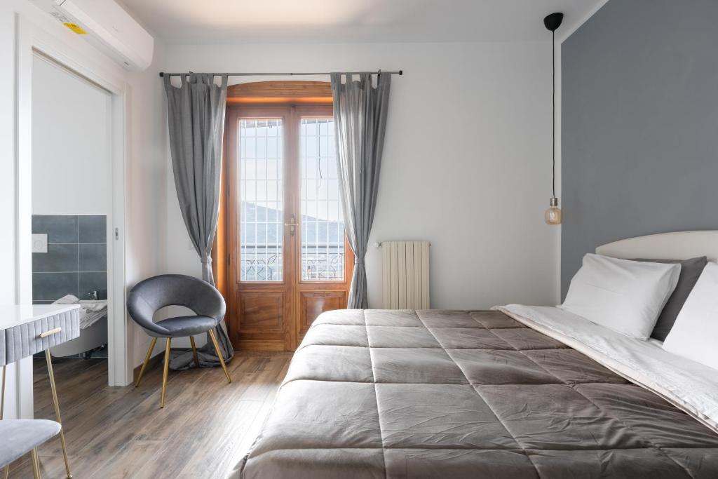 Postel nebo postele na pokoji v ubytování SEASCAPE - Noemi's Rooms