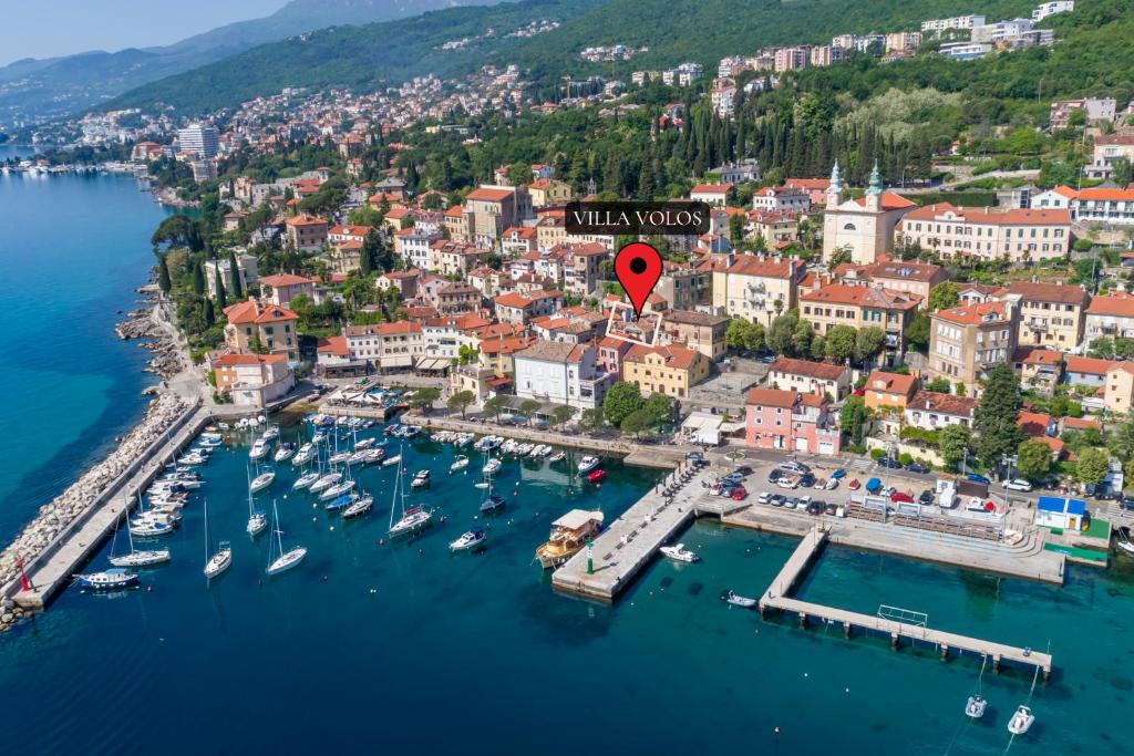 an aerial view of a harbor with boats in the water at Villa Volos, Free PRIVATE PARKING, Apartment Pupa with a jacuzzi on the roof terrace, and apartment Ela in Opatija