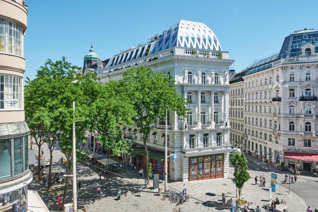a rendering of a city street with buildings at Hotel MOTTO in Vienna