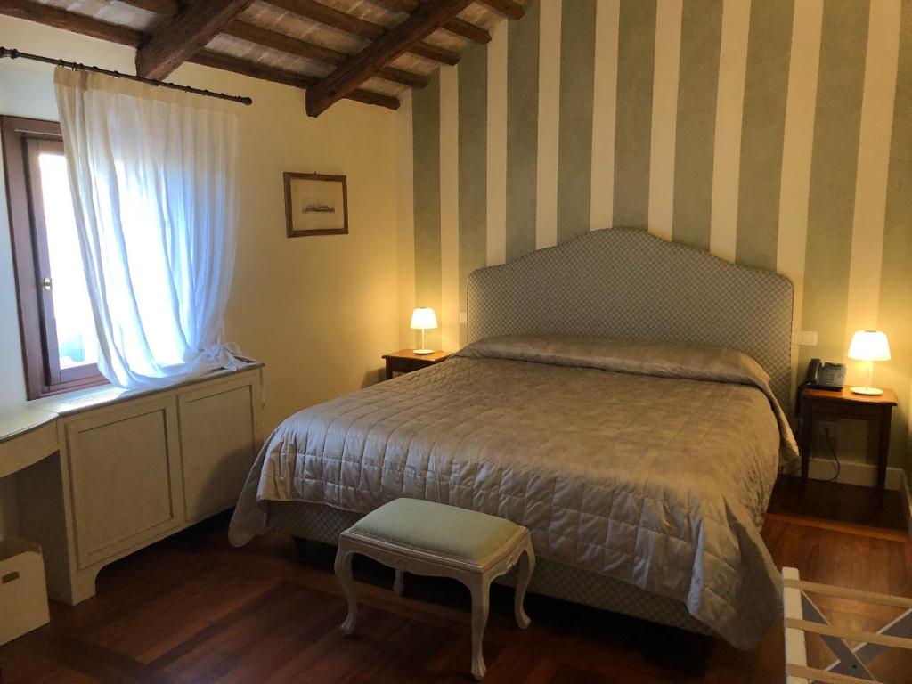 Postel nebo postele na pokoji v ubytování Hotel Donna Lucia