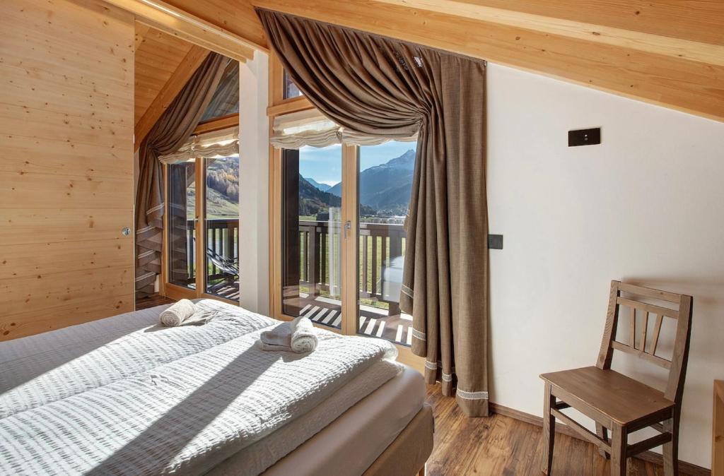 Postel nebo postele na pokoji v ubytování Olympic Chalet