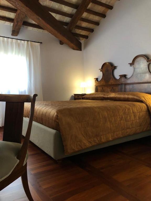 Postel nebo postele na pokoji v ubytování Hotel Donna Lucia