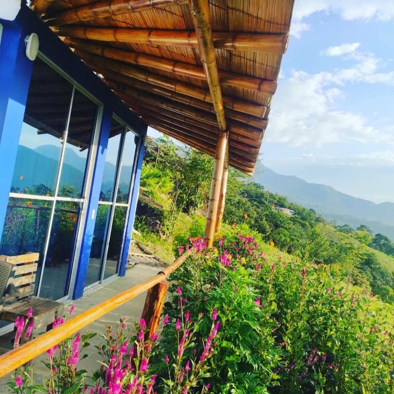 a house with a view of the mountains at Cabañas Mirador La Roca in Melgar