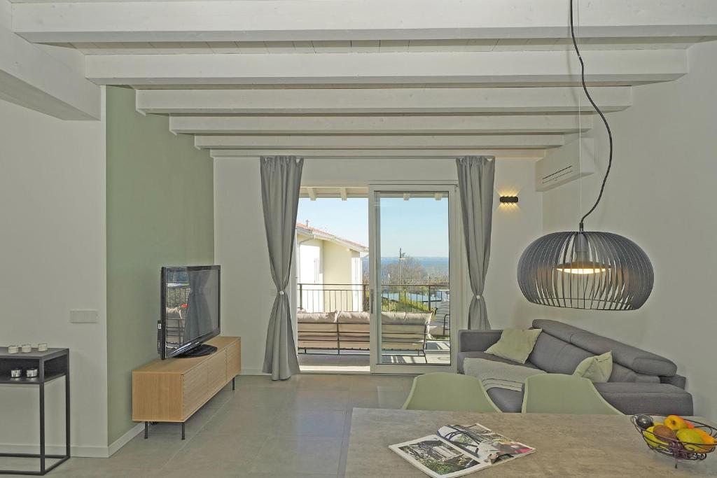 A television and/or entertainment centre at La Cittadella P1-14 by Wonderful Italy