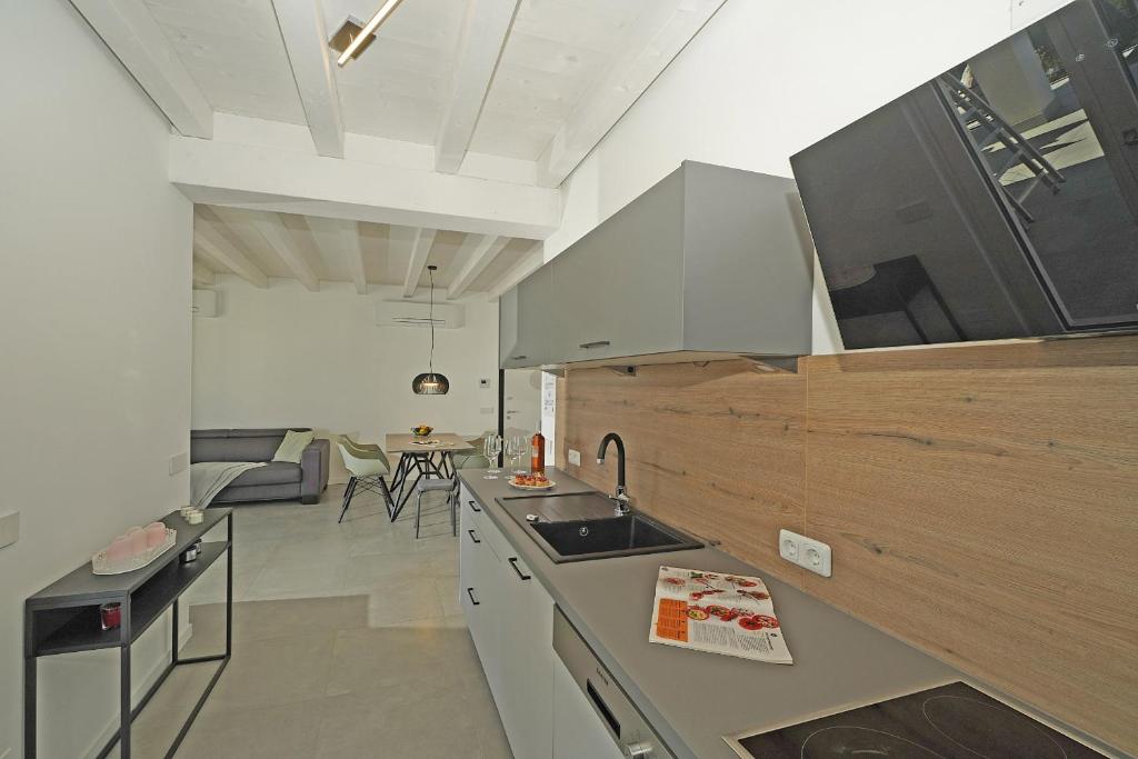 A television and/or entertainment centre at La Cittadella P1-14 by Wonderful Italy