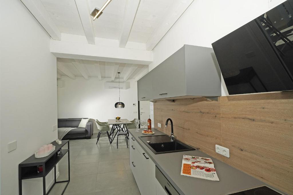 A television and/or entertainment centre at La Cittadella P1-14 by Wonderful Italy