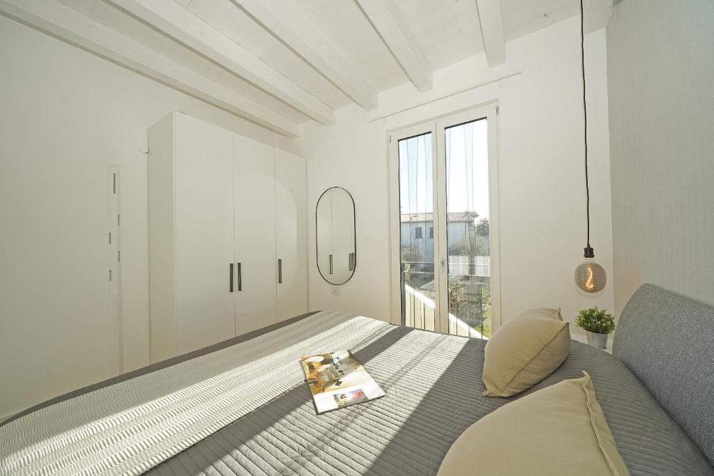 A bed or beds in a room at La Cittadella P1-14 by Wonderful Italy