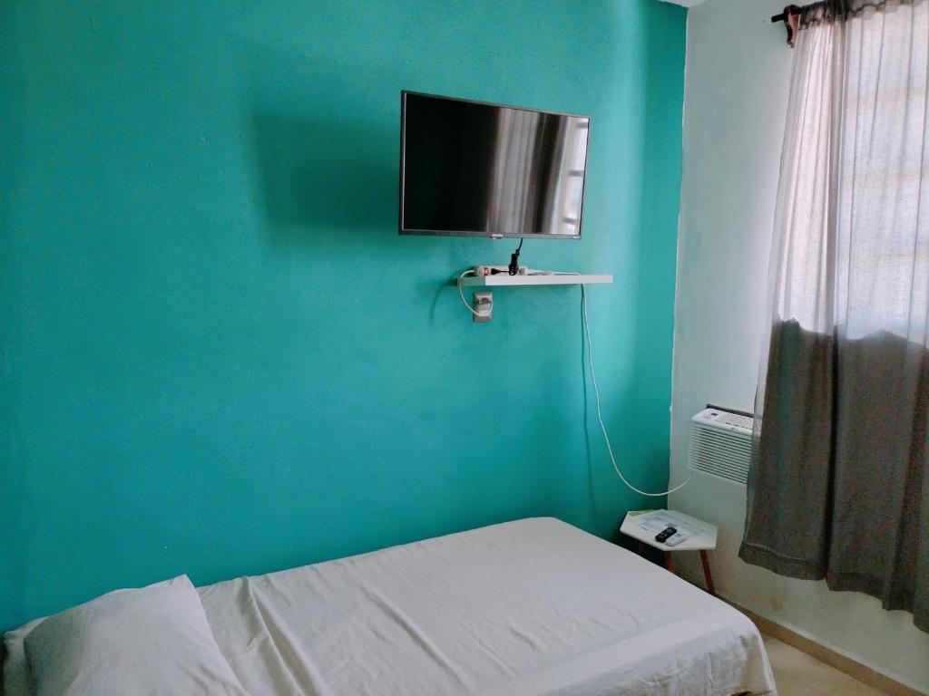 TV a/nebo společenská místnost v ubytování Relax Home Aeropuerto-Tren Maya