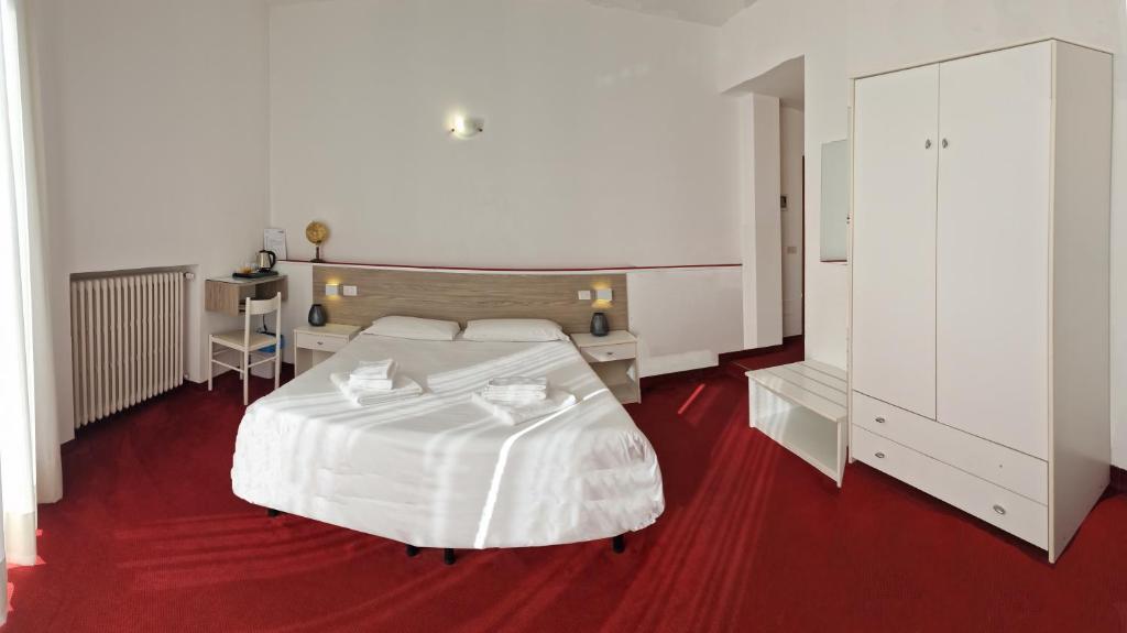 Postel nebo postele na pokoji v ubytování Hotel Beretta