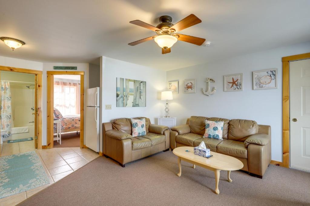 a living room with two couches and a ceiling fan at Wells Vacation Rental about 1 Mi to Beach Access! in Wells