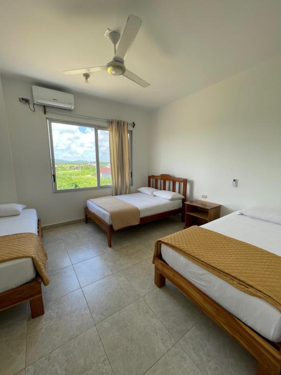 Postel nebo postele na pokoji v ubytování Samana Hostal, Puerto Engabao