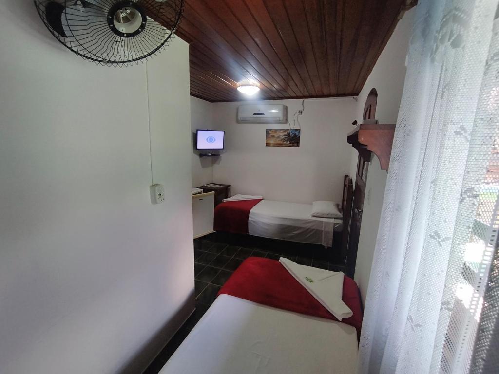 Postel nebo postele na pokoji v ubytování Pousada Taquinha Paraty - CENTRO