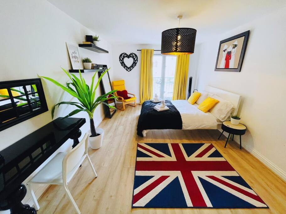 a bedroom with a bed with a british flag rug at Bristol City Stays - 1 Bed - Pembroke Court in Bristol