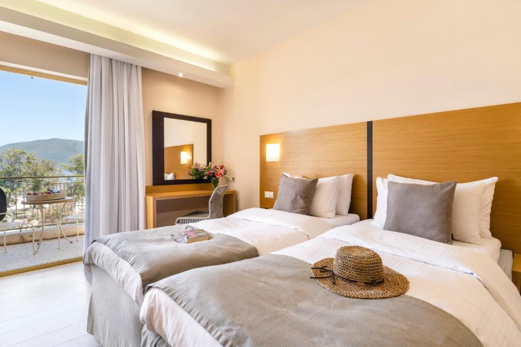 Postel nebo postele na pokoji v ubytování Hotel Lefkas