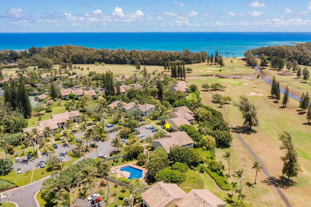 an aerial view of a house with the ocean in the background at Kuilima Estates East 41 - Plumeria Tree House in Kahuku