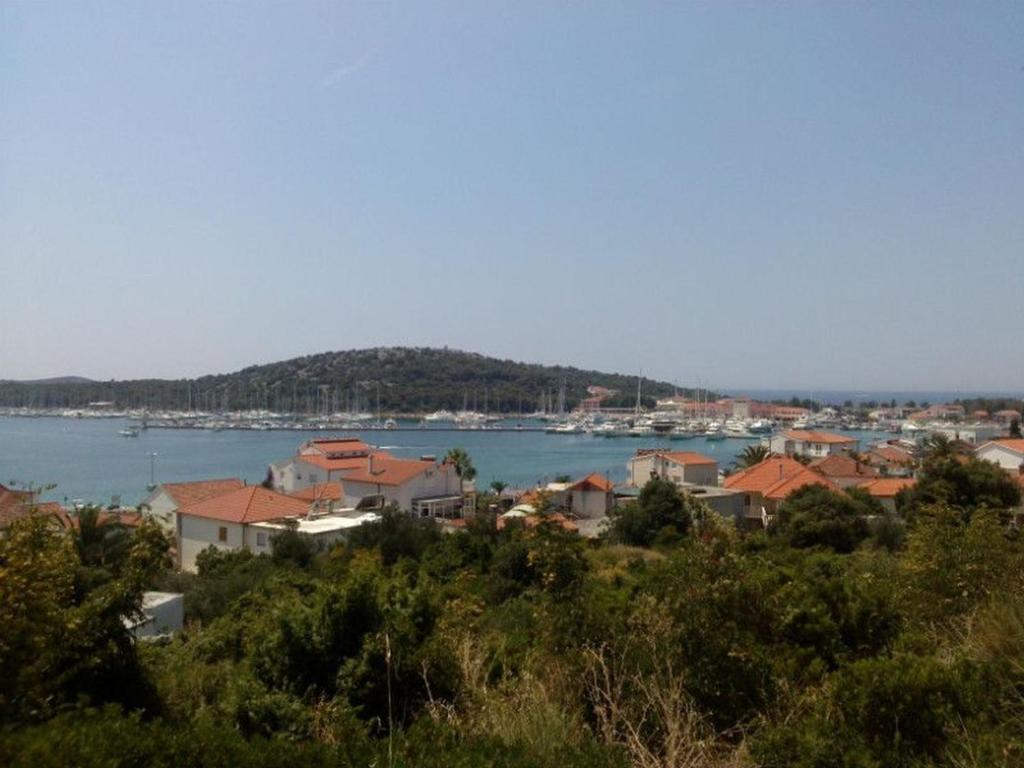 a view of a town and a body of water at Apartments Branislav in Rogoznica