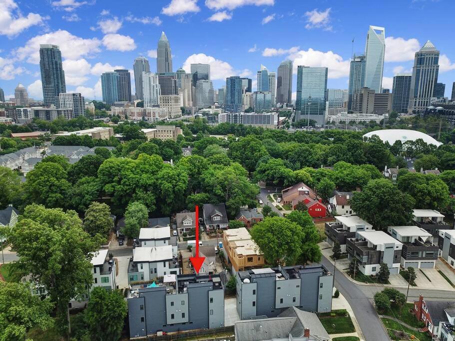 an aerial view of a city with a red arrow at City Views RoofTop Hot Tub & Short Walk to Stadium in Charlotte