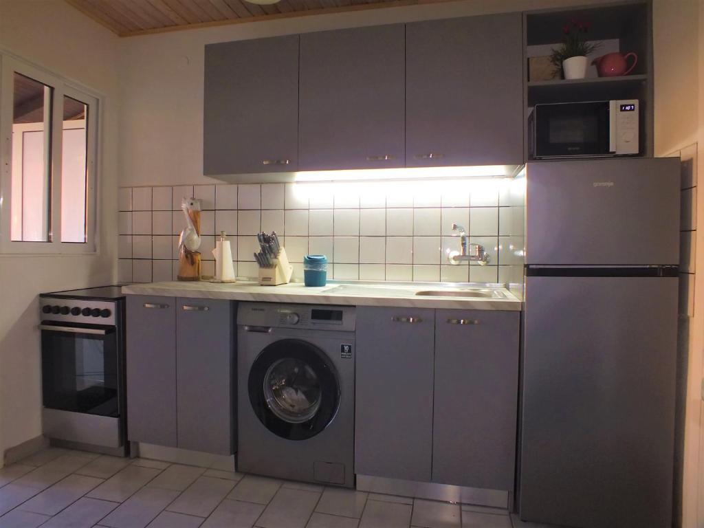 A kitchen or kitchenette at Asprovalta Family Villas