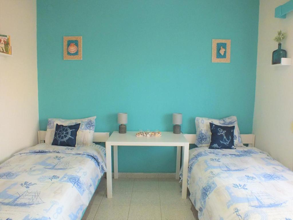 A bed or beds in a room at Asprovalta Family Villas