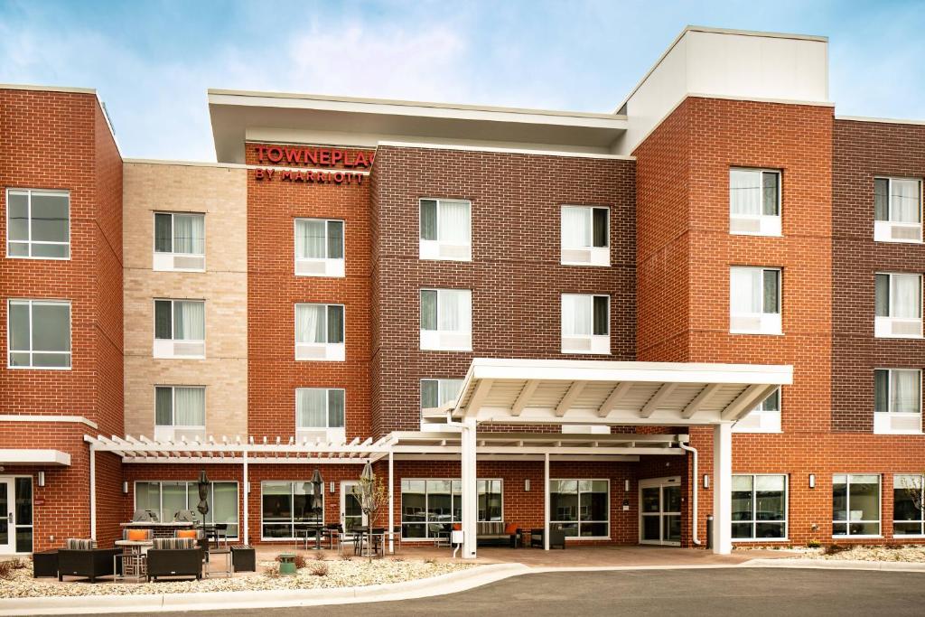 a red brick building with a hotel at TownePlace Suites by Marriott Dubuque Downtown in Dubuque